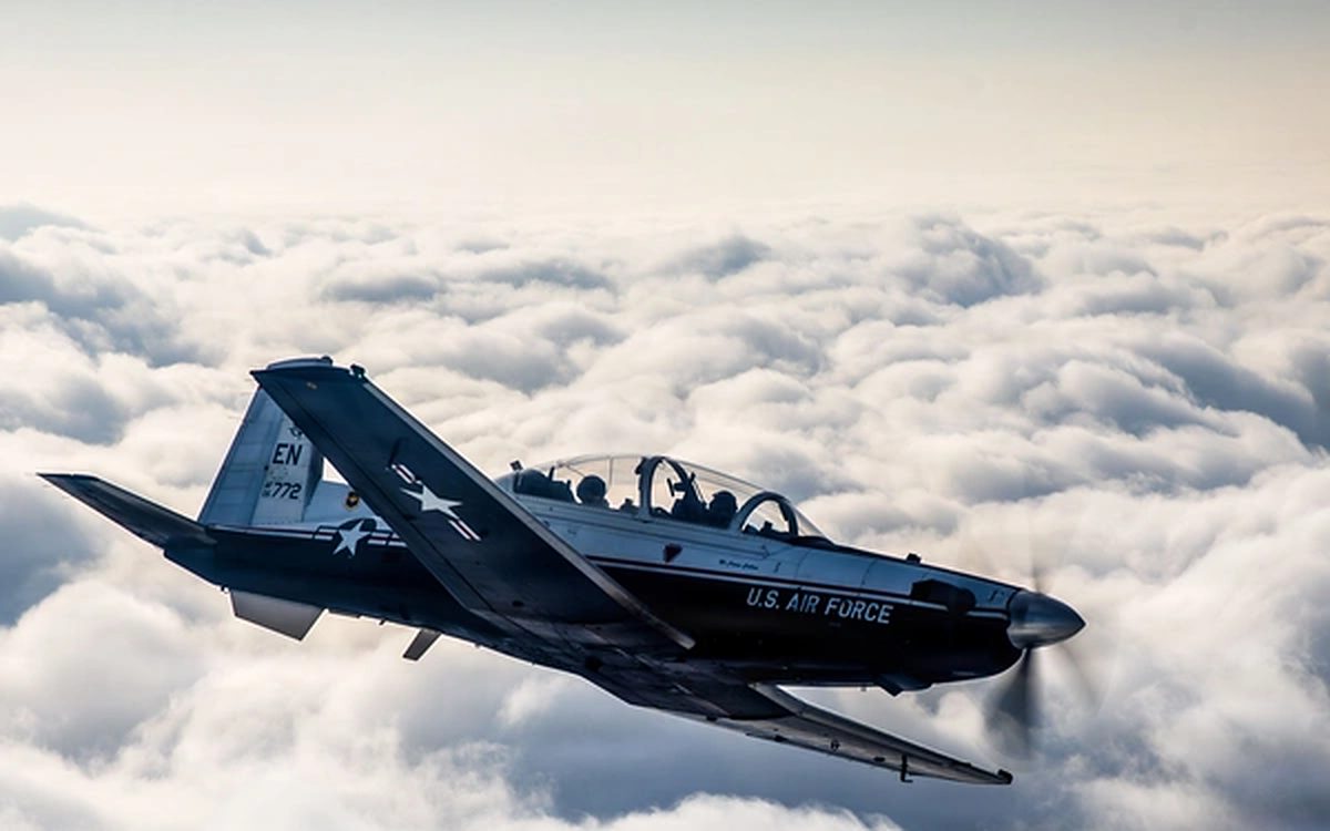 U.S. Air Force T-6 trainer flying above the clouds